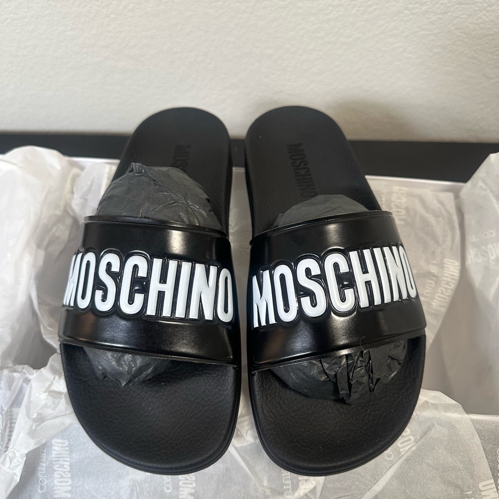 Moschino logo slides